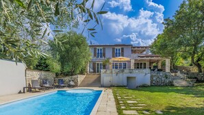 A modern house with a swimming pool, stone walls, and a well-maintained lawn. - Ardiletta by Interhome (Poreč/Baderna)