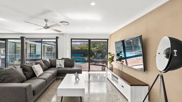 Deluxe House, 4 Bedrooms | Living area | Flat-screen TV