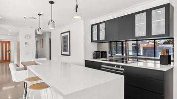 Deluxe House, 4 Bedrooms | Private kitchen | Full-size fridge, microwave, oven, stovetop