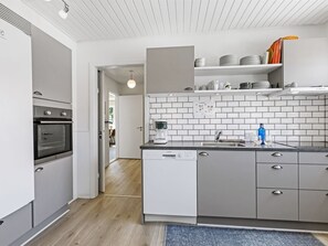 Enjoy cooking in this well-equipped kitchen with oven, dishwasher, and coffee maker.