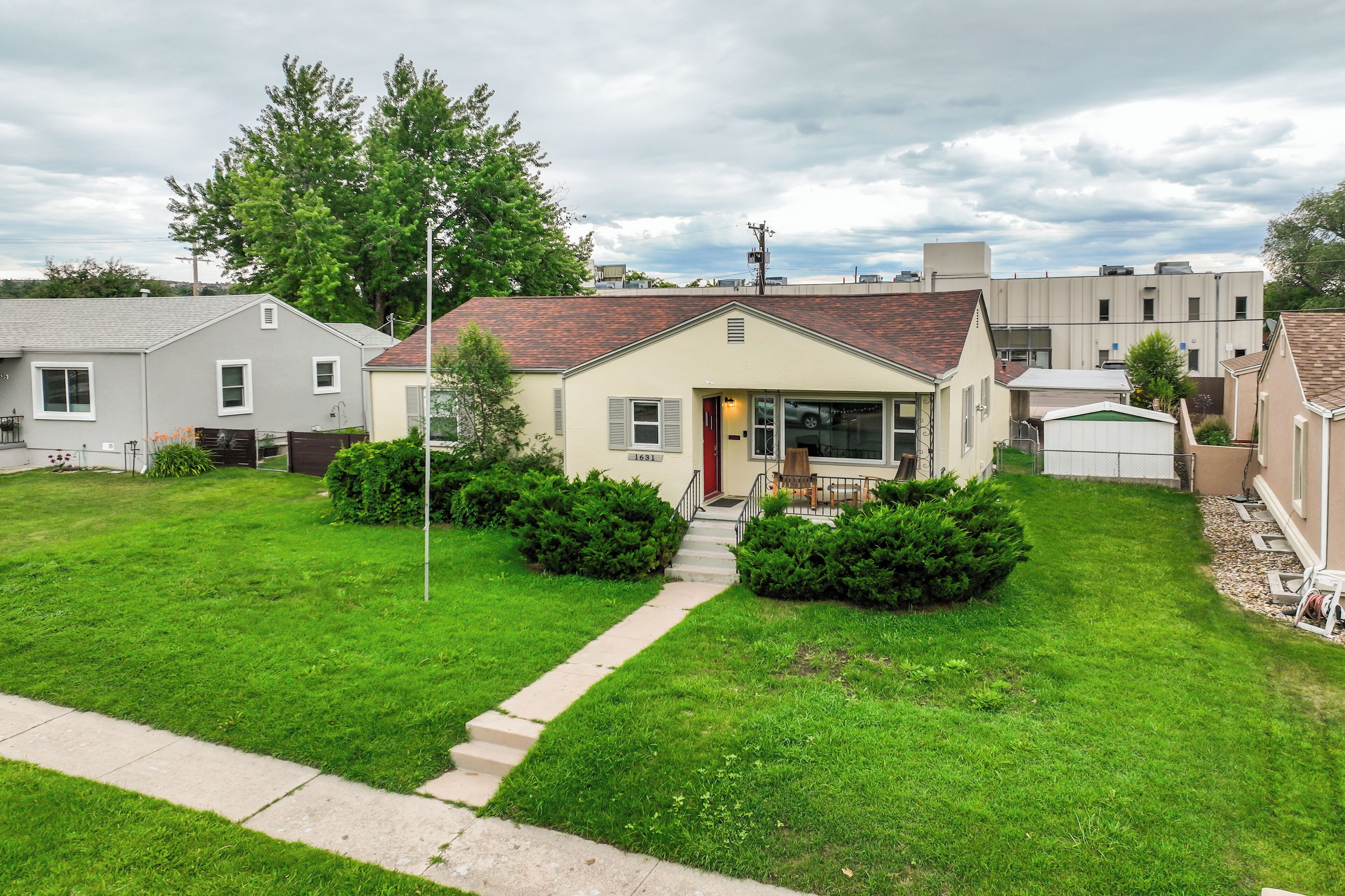 A residential house with a front yard, a driveway, and a garage.
