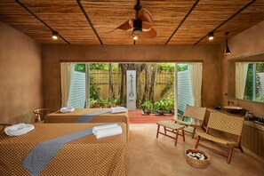 A room with two beds, a wooden ceiling, a window with curtains, a sink, and a mirror. - Coastal Escape Koh Yao Noi (Ko Yao)