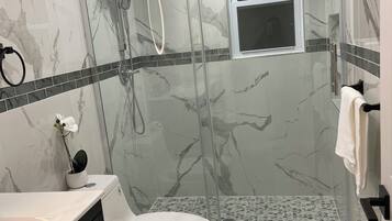 Shower, hair dryer, towels, soap