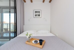 Apartment, 1 Bedroom, Balcony | 1 bedroom, individually furnished, laptop workspace, iron/ironing board