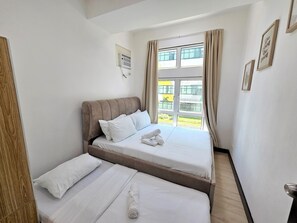 2 bedrooms, in-room safe, iron/ironing board, travel cot