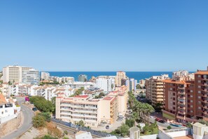 A coastal cityscape with a mix of residential and commercial buildings, a clear blue sky, and the sea in the distance. - Yucas Vistamar in Fuengirola (Fuengirola)