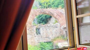 Luxury Double Room, Courtyard View | In-room safe, desk, laptop workspace, blackout drapes