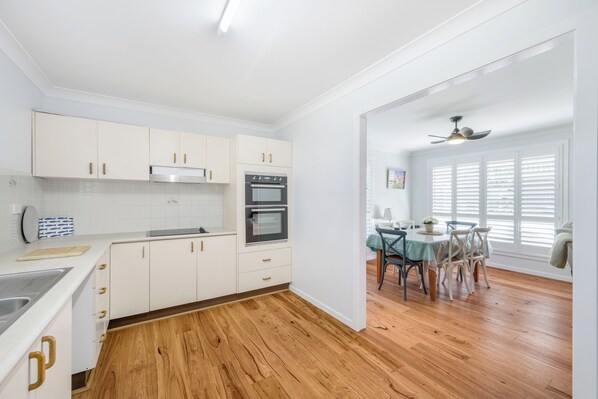 Enjoy meals in the kitchen with stainless steel appliances and adjacent dining area.