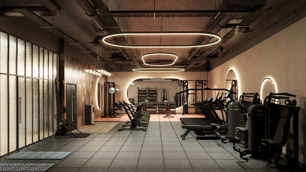 Een moderne sportschool met fitnessapparatuur, een spiegelwand en een vloer met een patroon.
