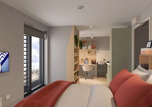 Un dormitorio moderno con una cama grande, un escritorio y vistas a un paisaje urbano a través de una ventana.