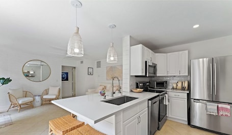 Fridge, microwave, oven, stovetop. Beachside Modern Wellness Villa with Spacious Patio, Walk to the Beach