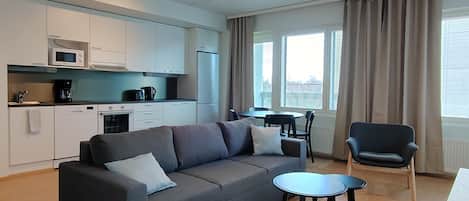 Standard Apartment, Balcony | Living area | Flat-screen TV