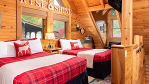 A cabin with two beds, a ceiling fan, a TV, and a sign that reads "RISE & SHINE". - Cozy Upscale Cabin w Fireplace Hot Tub (Sevierville)