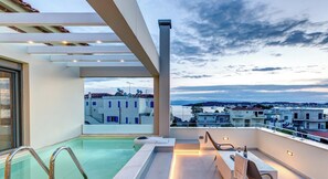 A rooftop pool area with a view of the cityscape.