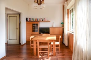 Apartment, Lake View | Living area | 35-inch TV with digital channels
