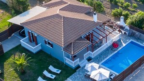 A two-story house with a swimming pool, a covered patio, and a fenced backyard. - Villa Rose With Private Pool (Zakynthos)