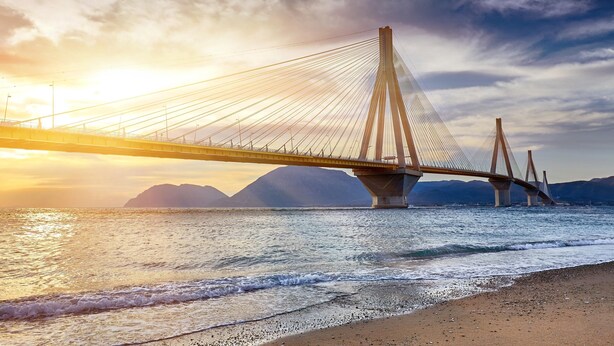 A suspension bridge over a body of water with mountains in the background. - Villa John Dimeon With Private Pool (West Achaea)