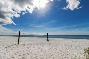 A beach with white sand and a clear blue sky. - Luxury Penthouse Condo directly on the water (Panama City Beach)