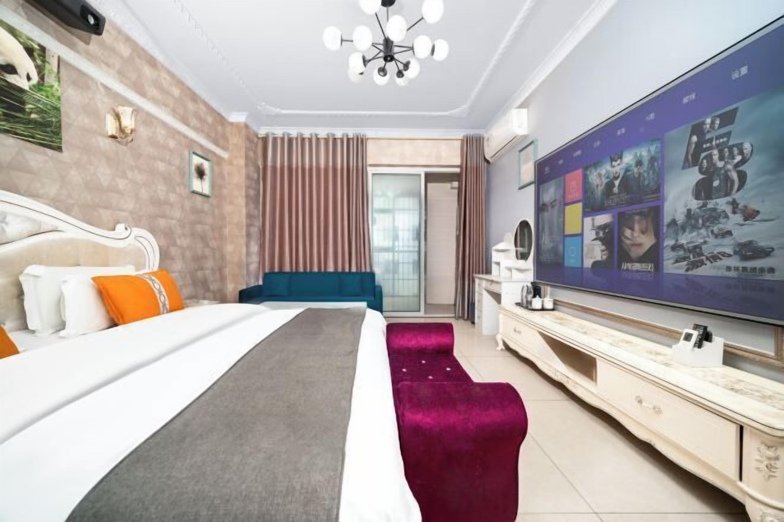 A hotel room with a bed, a TV, a dresser, and a door leading to a balcony.