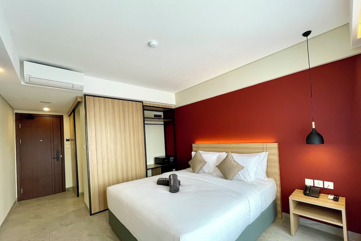 Luxe beddengoed, een minibar, een kluis op de kamer, een bureau