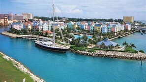 Guests can enjoy waterfront views from the hotel's pastel-colored buildings, which line the coast and offer access to a pool and gardens.