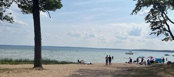 Enjoy views of beautiful Houghton Lake in charming LARGE home that sleeps 10. 