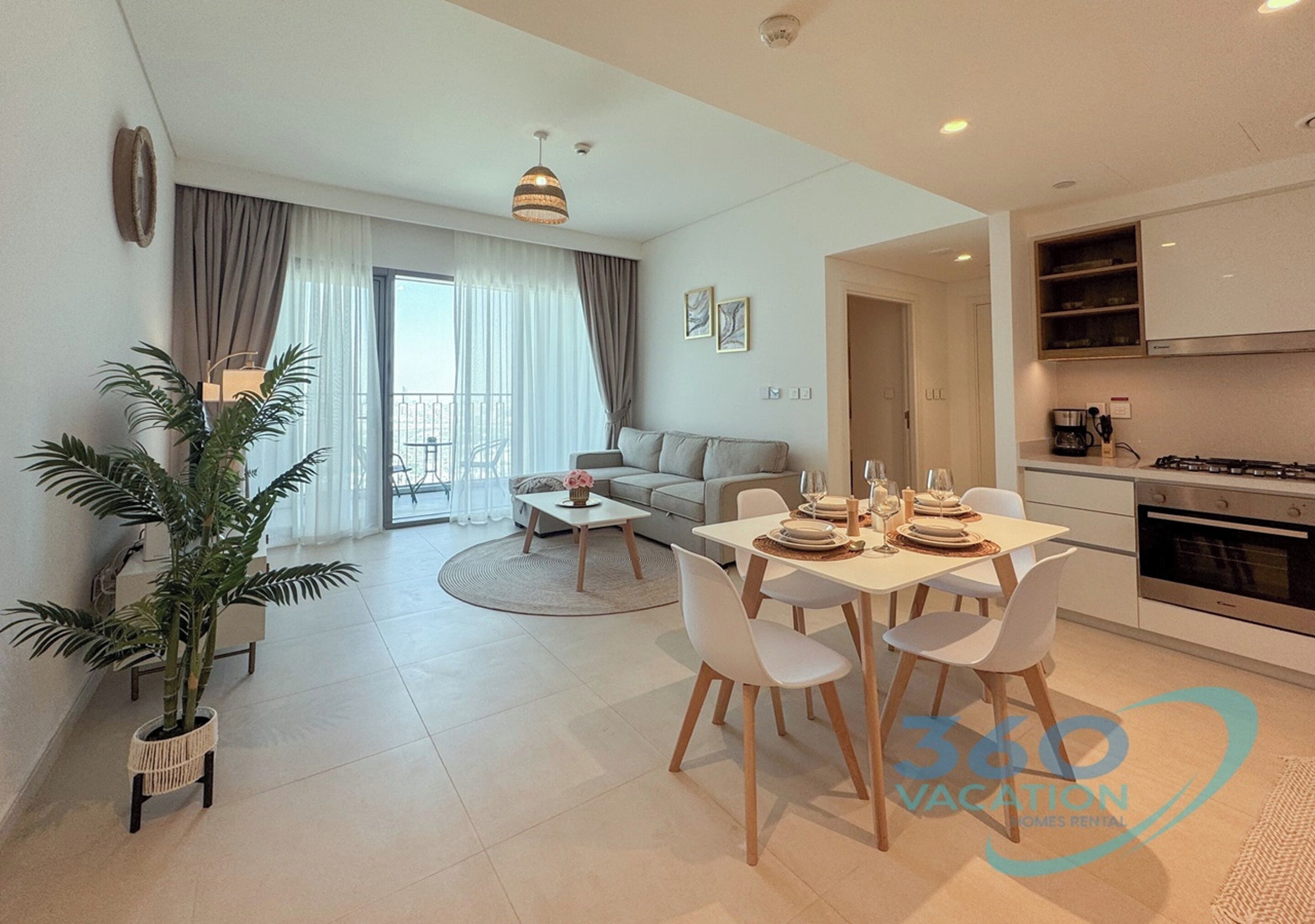 Un apartamento moderno con comedor, cocina y sala de estar.