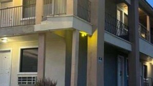 A two-story building with balconies, a concrete facade, and a flat roof. - MG INN & SUITES (Zapata)