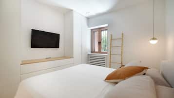 Departamento superior, vista al patio | Sábanas de algodón egipcio y ropa de cama de alta calidad
