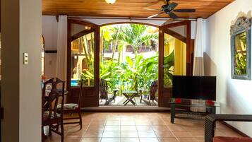 Basic Apartment, Garden View | Living area | 40-inch Smart TV with satellite channels