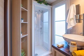 Shower, hair dryer, towels, soap