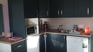 Chalet | Private kitchen | Fridge, microwave, stovetop, dishwasher - Reopened for 2024 Season Warm & Cosy Little Chalet (Abbeyknockmoy)