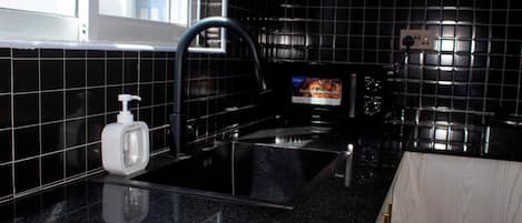 Fridge, microwave, stovetop, cookware/dishes/utensils
