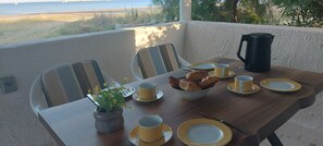 Outdoor dining - Charming beachfront 2-bedroom house with AC and WiFi. (Katakolo)