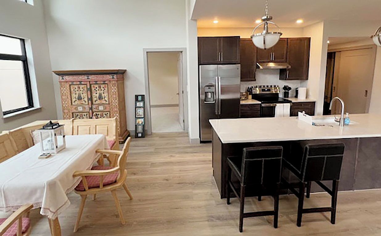 Skywalk 2-bedroom Modern Condo with covered parking and rooftop hot tub.