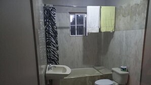 A small bathroom with a toilet, sink, and shower. - Pvalley Suite 10B 1 Bedroom (Hatfield)