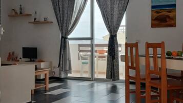 Panoramic Apartment, Bay View | Living area | 60-cm flat-screen TV with digital channels