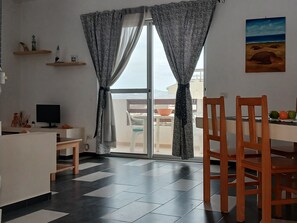 Panoramic Apartment, Bay View | Living area | 60-cm flat-screen TV with digital channels - Kolatilde-  Estoril Beach Flat (Boa Vista)