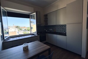 Fridge, oven, dishwasher, dining tables