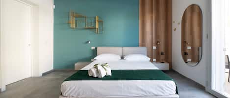 A modern bedroom with a bed, a wall-mounted light, and a wooden panel wall.