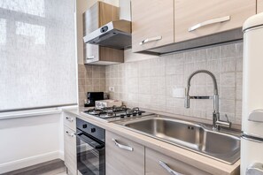 Fridge, oven, coffee/tea maker, cookware/dishes/utensils