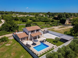 Experience a classic Mediterranean aesthetic in this two-story building, blending traditional and modern styles.