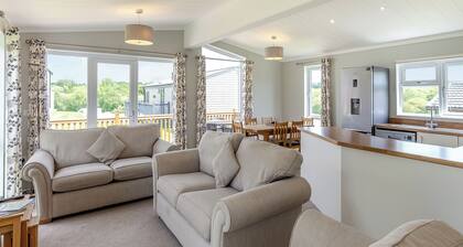 Escape to the Jasmine Lodge, nestled amidst stunning rolling countryside.