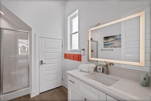 Shower, hair dryer, towels, shampoo