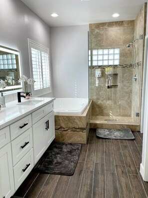 Shower, jetted tub, hair dryer, towels