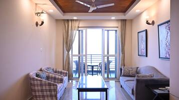 Luxury Room, 3 Bedrooms, Hill View | Living area | 32-inch TV with satellite channels