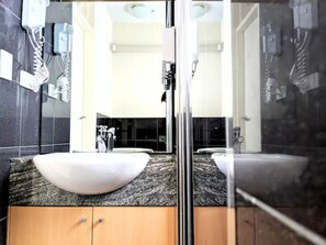Shower, hair dryer, towels, soap