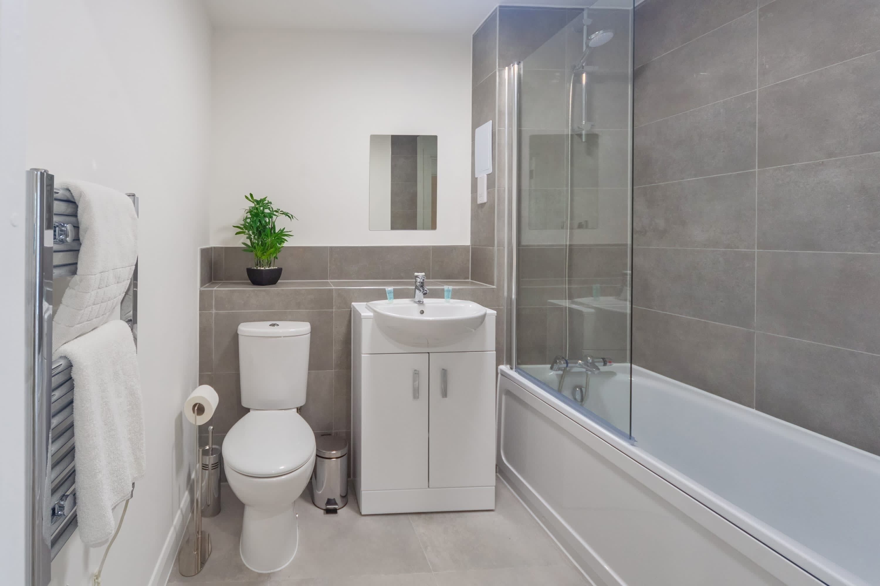 Shower, hair dryer, towels, shampoo