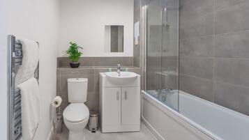 Shower, hair dryer, towels, shampoo
