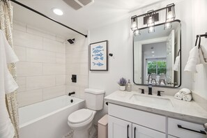 Shower, hair dryer, towels, shampoo